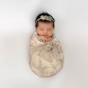 newport beach newborn girl in beige lace wrap
