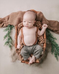 A newborn baby boy is laying in a basket in San Francisco.